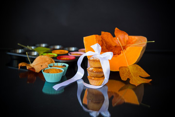 baked sweet pumpkin muffins with dried apricots inside