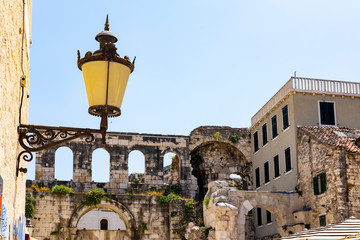 Fototapeta na wymiar Lantern and romans columns near Diocletian palace UNESCO world heritage site in Split, Dalmatia, Croatia 