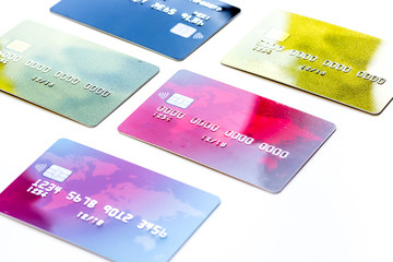 pile of credit cards on white background