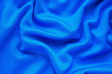 Fototapeta na wymiar Blue football jersey clothing fabric texture sports wear background, close up top view