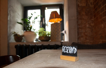Inscription reserve on the table in a cafe