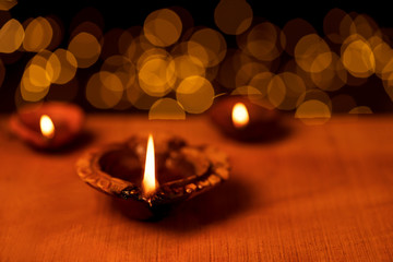 Diwali Decorations With Diya or Oil Lamp.Clay diya oil lamps lit during diwali celebbration with...