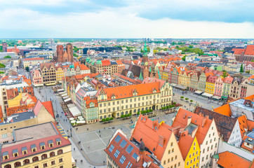 Fototapeta na wymiar Top aerial panoramic view of Wroclaw old town historical city centre with Rynek Market Square, Old Town Hall, New City Hall, colorful buildings with multicolored facade and tiled roofs, Poland