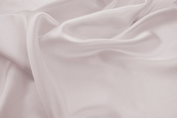 Delicate satin draped fabric pink texture for festive backgrounds