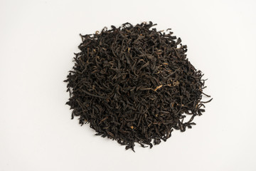 Many different types of black tea on a white background