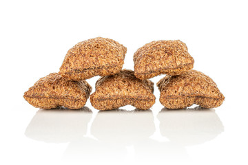 Group of five whole crispy brown cereal pillow isolated on white background