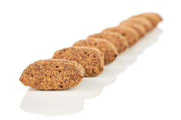Lot of whole crispy brown cereal pillow placed diagonally isolated on white background