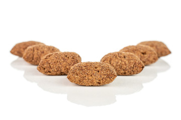 Group of seven whole crispy brown cereal pillow isolated on white background