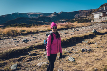 young woman walking in the mountains