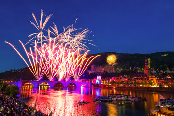 Colored fireworks over the river