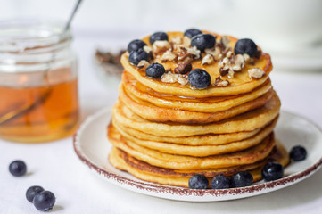 fluffy pancakes with honey and berries