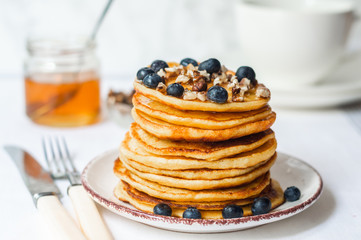 fluffy pancakes with honey and berries