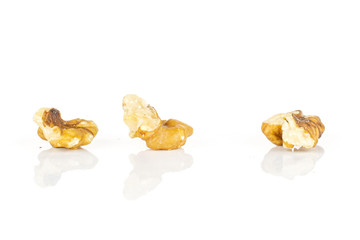 Group of three pieces of brown almond nut isolated on white background
