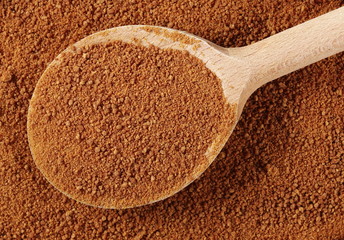 Coconut palm sugar in wooden spoon background and texture 