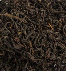 Many different types of black tea on a white background