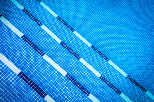 Blue gresite pool bottom. Summer, water sports and relax concept.