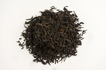 Many different types of black tea on a white background