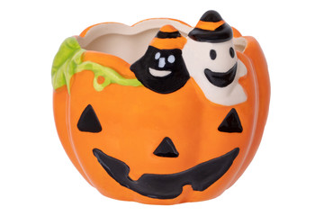 Halloween pumpkin isolated. Close-up of a empty decoration Halloween pumpkin vase with a black and a white ghost on it isolated on a white background. Macro.