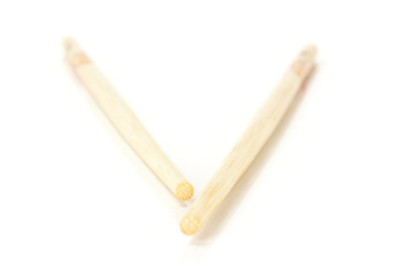 Group of two whole asian brown chopsticks isolated on white background