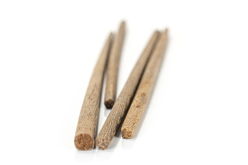 Group of four whole dark asian brown chopsticks isolated on white background