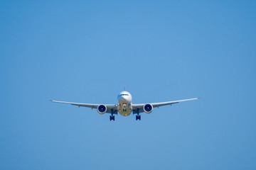 Passenger airplane in the blue sky