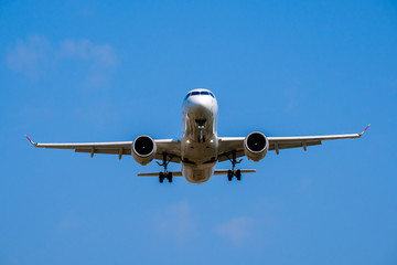 Passenger airplane in the blue sky