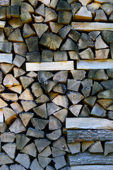 Stacked firewood background on full frame