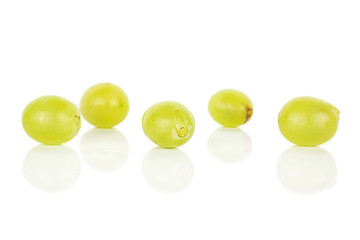 Group of five whole fresh green grape isolated on white background