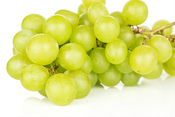 Lot of whole fresh green grape cluster isolated on white background
