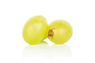 Group of two whole fresh green grape front focus isolated on white background