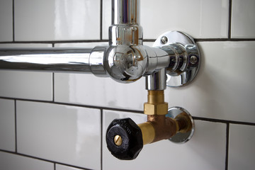 Traditional brass valve on a chrome heated towel rail