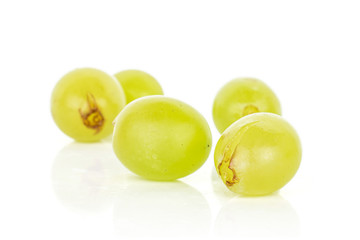 Group of four whole fresh green grape isolated on white background