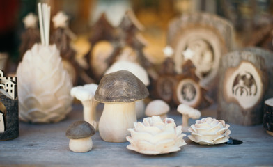 wooden souvenirs at the market counter for tourists