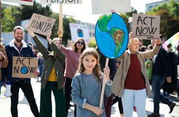 People with placards and posters on global strike for climate change. - obrazy, fototapety, plakaty