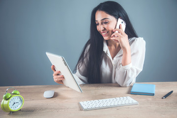 happy woman hand phone with tablet