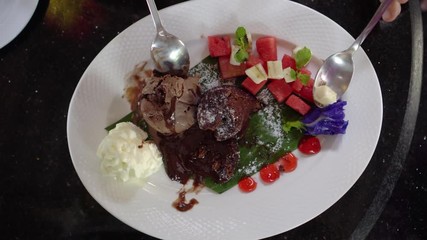 Chocolate lava cake with ice cream with fruits