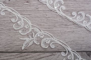 Naklejka premium texture, background, pattern. white lace fabric. This wonderful lace is perfect for your design, wedding jewelry, This lace has a beautiful rich texture and feels to it.