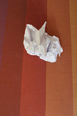Crumpled sheet of paper on the table