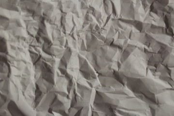 Crumpled sheet of paper on the table