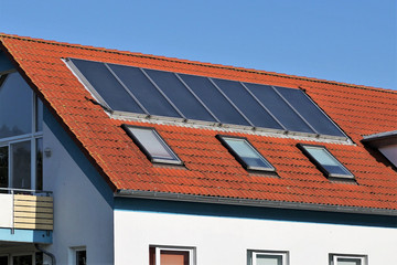 Fototapeta premium Solar energy panels on roof of house