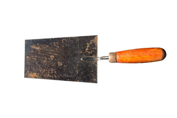 An old, rusty trowel with an orange handle on the right, isolated on white background with a...