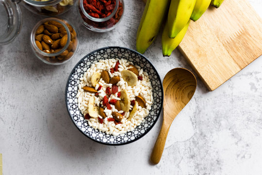 Bowl of fresh muesli and ingredients seen from above