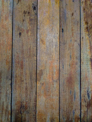 The texture of wood planks commonly used for benches or floors.