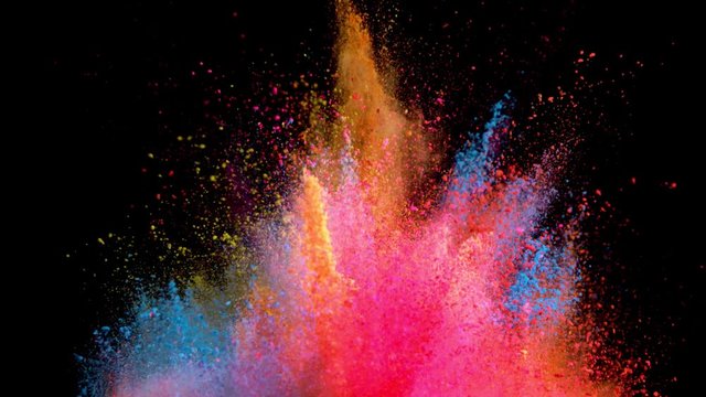 Super slow motion of coloured powder explosion isolated on black background. Filmed on high speed cinema camera, 1000fps.