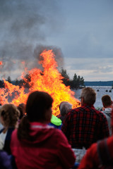Fototapeta na wymiar Midsummer bonfire. Traditional Finnish celebration Juhannus