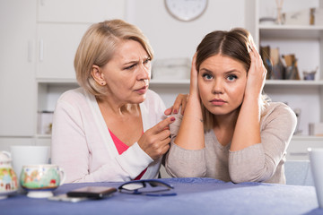 Mother scolds her adult daughter