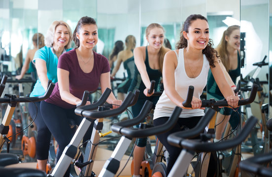 girl and other females working out in sport club