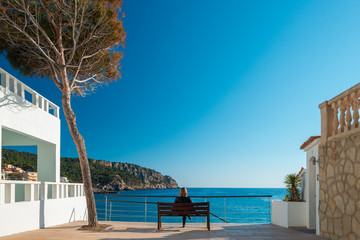 Girl looking at sea in Mallorca