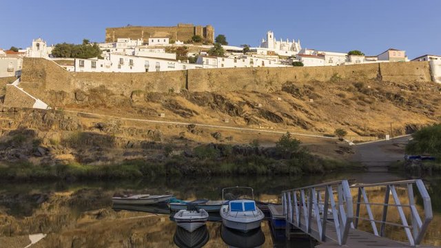 Sunrise timelapse view of the town of Mértola in southeastern Alentejo destination region, located in the margin of Guadiana River, whit its medieval castle, located on the highest point. Portugal.