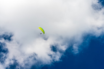 Paragliding in a cloudy sky